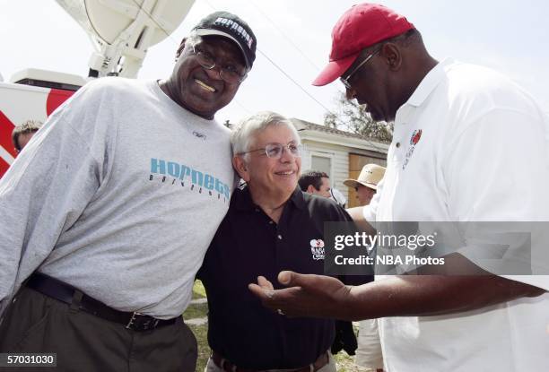 New Orleans Hornets Executive and NBA Legend Willis Reed hugs NBA Commissioner David Stern while he listens to NBA Legend Bob Lanier during a break...