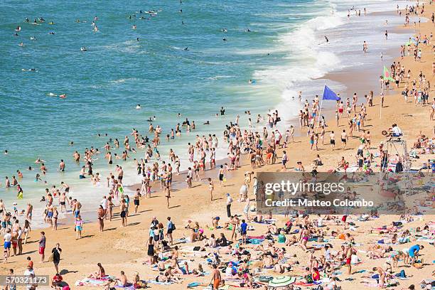 crowded beach in summer, elevated view. biarritz - france beach stock pictures, royalty-free photos & images