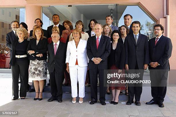 Chile's President elect Michelle Bachelet poses with her new cabinet 24 February, 2006 in Santiago prior to the start of their first meeting....