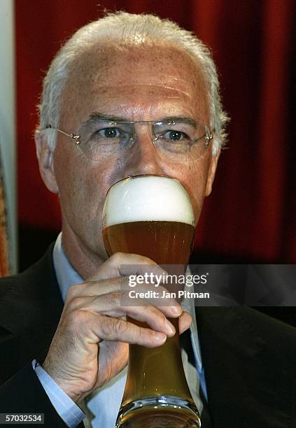 Franz Beckenbauer drinks a beer during a press conference on March 9, 2006 in Munich, Germany.