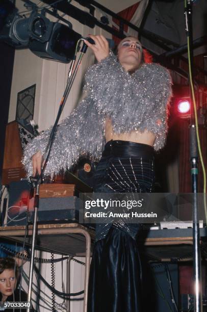 Experimental musician Brian Eno performing on stage with Roxy Music to promote the album 'For Your Pleasure', 1973. Eno left the group for a solo...