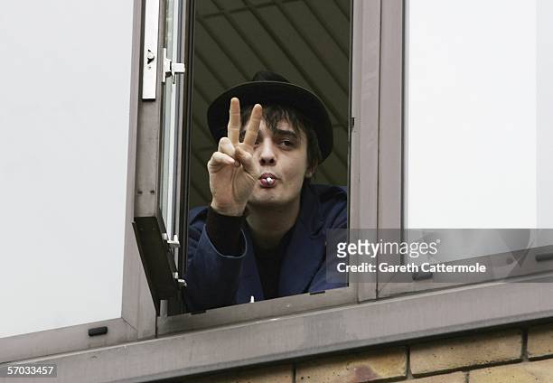 Babyshambles frontman Pete Doherty is seen at a window at court on March 9, 2006 in London, England. Doherty is appearing on bail charged with...