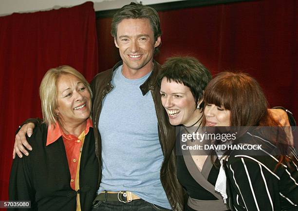 Australian star Hugh Jackman , who plays Peter Allen in "The Boy From OZ", poses with Angela Toohey as Liza Minelli, Chrissy Amphlett as Judy Garland...