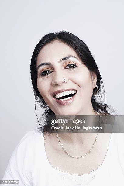portrait of a mature woman laughing - pierced nose stock pictures, royalty-free photos & images
