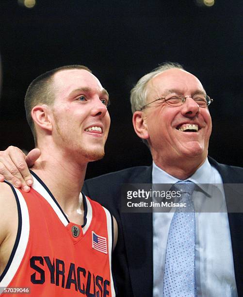 Gerry McNamara and head coach Jim Boeheim of the Syracuse Orange smile after defeating the Connecticut Huskies 86-84 in overtime during the...