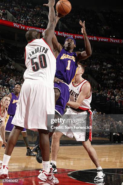 Smush Parker of the Los Angeles Lakers takes the ball to the basket against Zach Randolph of the Portland Trail Blazers during the game on March 1,...