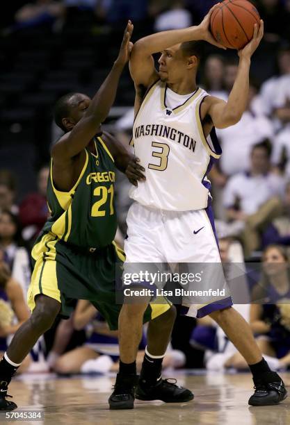 Brandon Roy of the Washington Huskies looks for an open pass over Adrian Stelly of the Oregon Ducks during the quarterfinals of the 2006 Pacific Life...