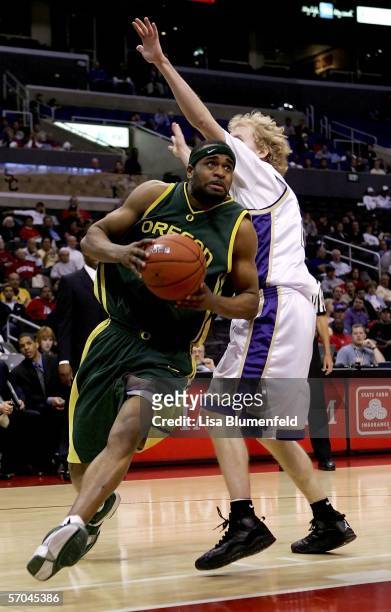 Malik Hairston of the Oregon Ducks drives past Ryan Appleby of the Washington Huskies during the quarterfinals of the 2006 Pacific Life Pac-10 Men's...