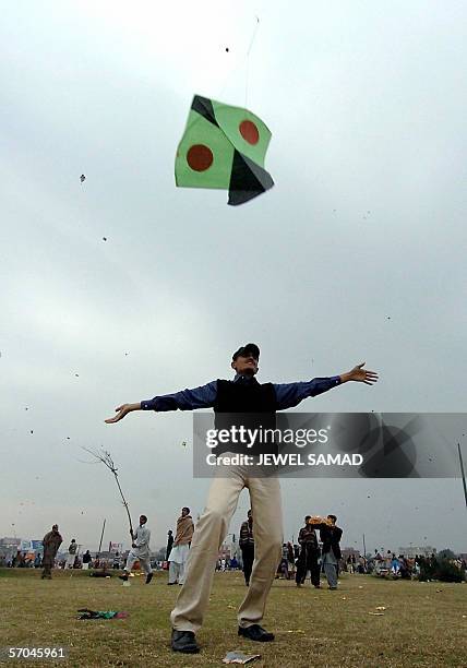 In this picture taken 06 February 2005, Pakistani youths enjoy flying kites during the Basant or kite flying festival in Lahore. Pakistan's eastern...