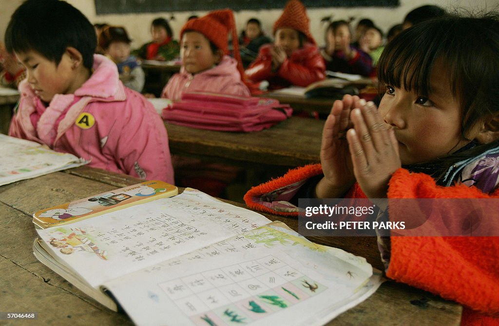 School children take class in a dilapida