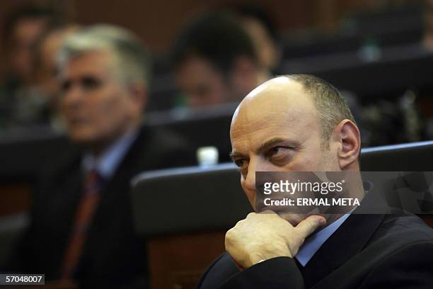 Pristina, SERBIA AND MONTENEGRO: Former guerrilla commander Agim Ceku talks listens to a speech in the Kosovo Parliament before his election as...