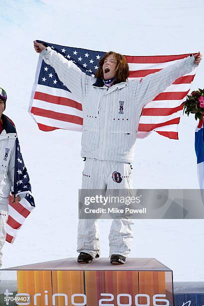 Shaun White of the USA celebrates winning the Gold medal in the Men's Halfpipe finals during Day 2 of the Turin 2006 Winter Olympic Games on February...