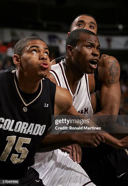 Chris Copeland, left, and Marcus King-Stockton of the Colorado Buffaloes box out Joseph Jones the Texas A&M Aggies during the quarterfinals round of...