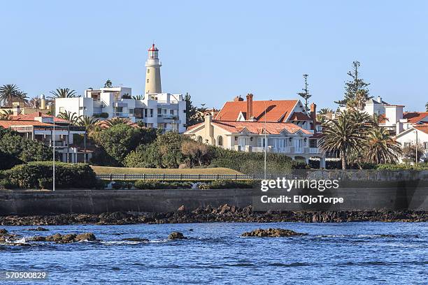 view of punta del este lighthouse and coastline - punta del este photos et images de collection