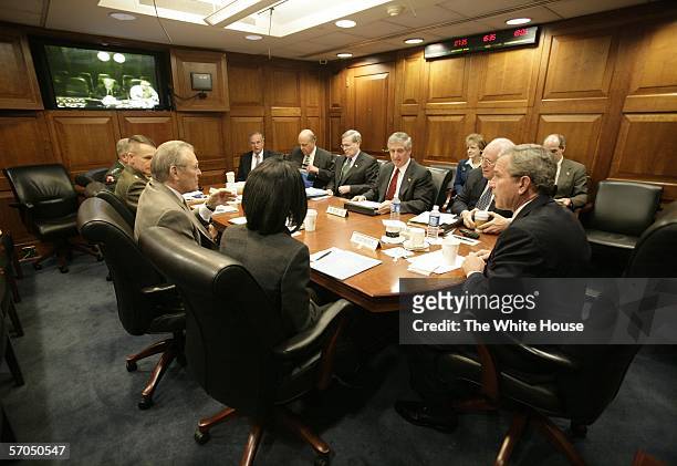 In this handout image provided by the White House, the U.S. President George W. Bush meets with his National Security team in the White House...