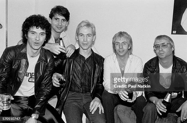 Portrait of American pop band the Fools as they pose backstage at the Park West Auditorium, Chicago, Illinois, April 10, 1980. Pictured are, from...