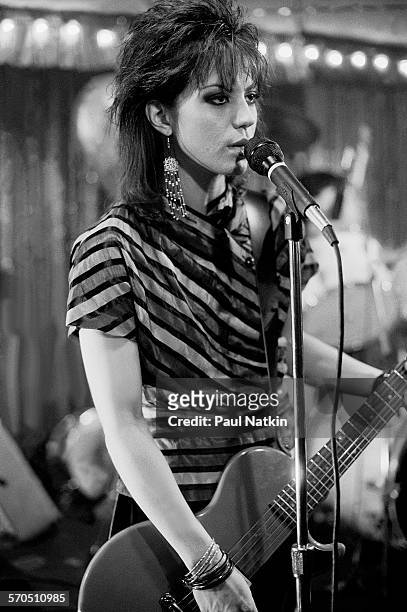 American musician Joan Jett performs onstage at the Thirsty Whale bar during filming of the movie 'Light of Day' , Chicago, Illinois, April 7, 1986.
