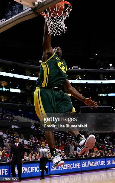 Ivan Johnson of the Oregon Ducks slam dunks in the final moments of the Ducks' win over the Washington Huskies during the quarterfinals of the 2006...