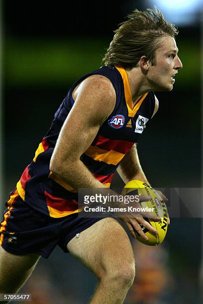 Trent Hentschel of the Crows runs the ball forward during the NAB Cup semi final match between the Adelaide Crows and the Melbourne Demons at AAMI...