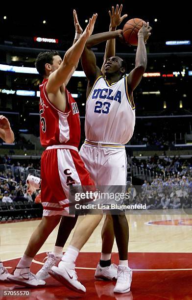 Luc Richard Mbah a Moute of the UCLA Bruins shoots over Ivan Radenovic of the Arizona Wildcats during the semifinals of the 2006 Pacific Life Pac-10...