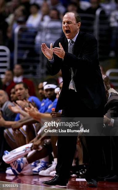 Head coach Ben Howland of the UCLA Bruins cheers for his team after a basket during their semifinal game against the Arizona Wildcats in the 2006...