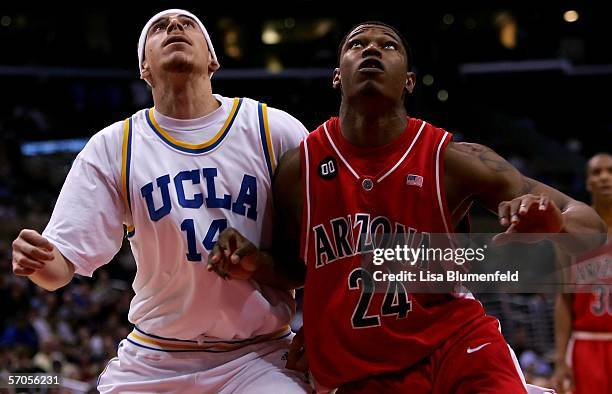 Lorenzo Mata of the UCLA Bruins and Fendi Onobun of the Arizona Wildcats battle for position under the basket during the semifinals of the 2006...