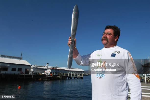 Cricket great, David Boon, carries the Melbourne 2006 Queen's Baton as part of the Melbourne 2006 Commonwealth Games Queen's Baton Relay March 11,...