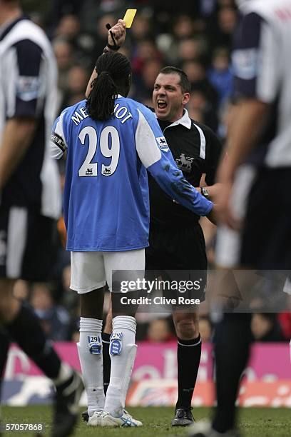 Mario Melchiot of Birmingham City is given a yellow card by match referee Phil Dowd during the Barclays Premiership match between Birmingham City and...