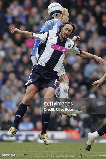 Jonathan Greening of West Bromwich Albion is tackled by Mikael Forssell of Birmingham City during the Barclays Premiership match between Birmingham...