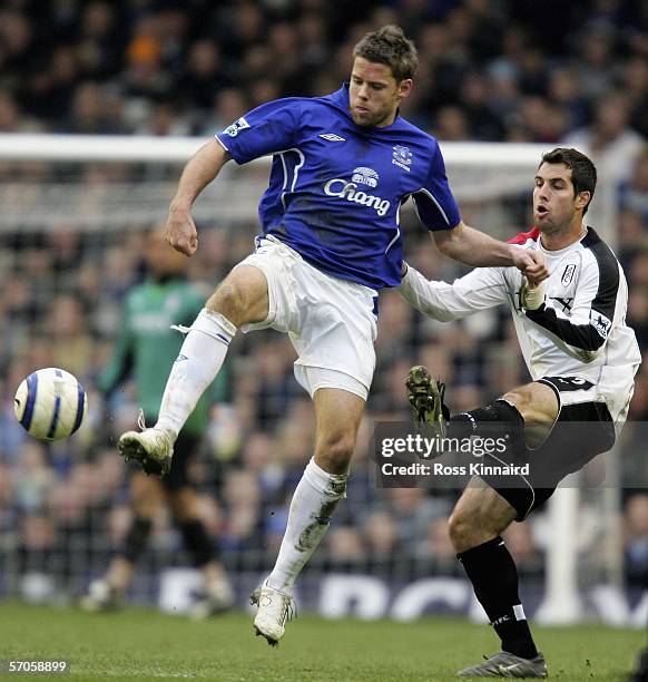 James Beattie of Everton is challenged by Carlos Bocanegra of Fulham during the Barclays Premiership match between Everton and Fulham at Goodison...