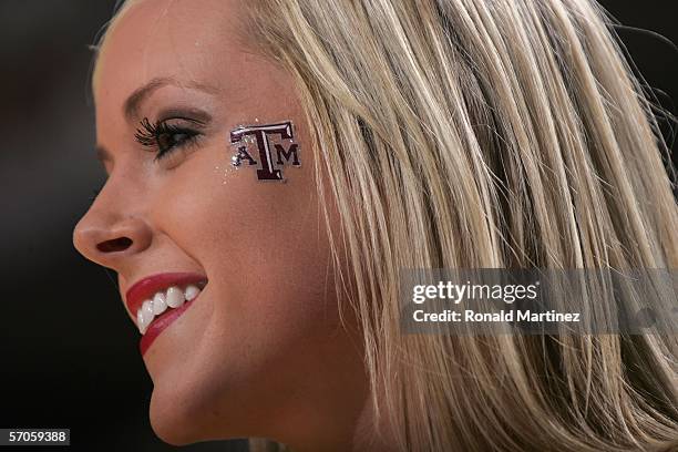 Texas A&M Aggies cheerleader smiles during the game against the Texas Longhorns against during the semifinals round of the Phillips 66 Big 12 Men's...