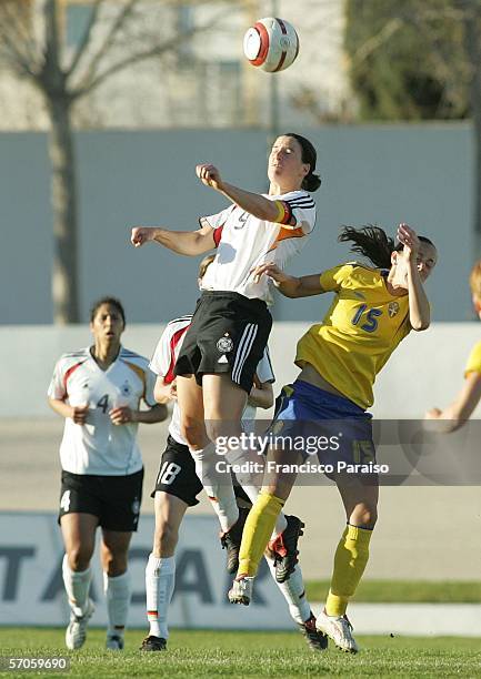 Brigit Prinz of Germany and Theresa Sjogran of Sweden jump for the ball during the Womens Algarve Cup match between Germany and Sweden on March 11,...