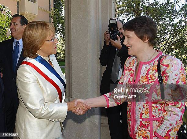 New Chilean President Michelle Bachelet shakes hands with New Zealand's Prime Minister Helen Clark 11 March, 2006 in Vina del Mar. Bachelet was sworn...
