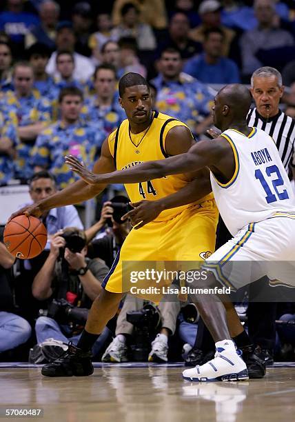 Leon Powe of the California Golden Bears is defended by Alfred Aboya of the UCLA Bruins during the championship final of the 2006 Pacific Life Pac-10...