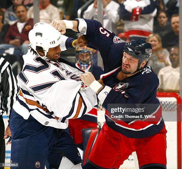 Left Wing Jody Shelley of the Columbus Blue Jackets lands a right hook to Right Wing Georges Laraque of the Edmonton Oilers at Nationwide Arena on...