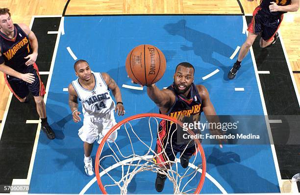 Baron Davis of the Golden State Warriors takes the ball to the hoop against the Orlando Magic March 11, 2006 at TD Waterhouse Centre in Orlando,...