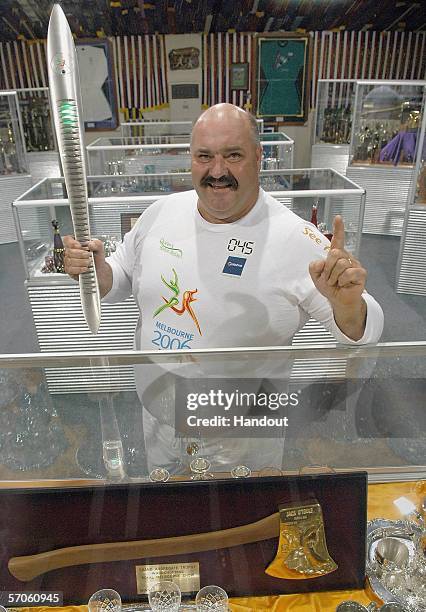 World famous axeman David Foster carries the Melbourne 2006 Queen's Baton through the Axeman's Hall of Fame as part of the Melbourne 2006...