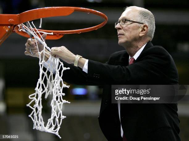 Head coach Steve Fisher of the San Diego State University Aztecs cuts down the net after defeating the Wyoming Cowboys 69-64 in the championship of...