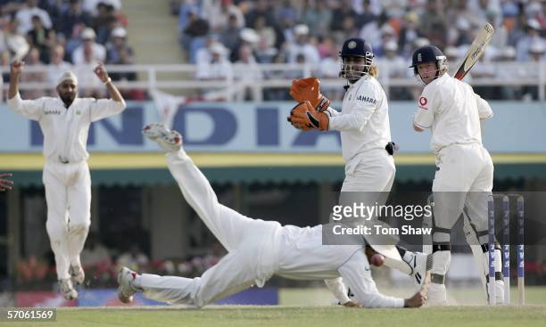 Paul Collingwood of England looks round to see a change put down by Virender Sehwag of India during day four of the Second Test Match between India...