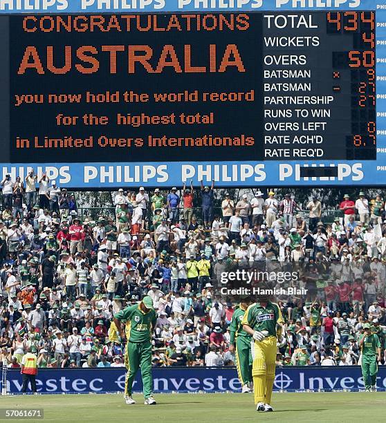 Brett Lee of Australia leaves the field at the end of Australia's innings as the scoreboard shows their World Record score of 434 during the fifth...