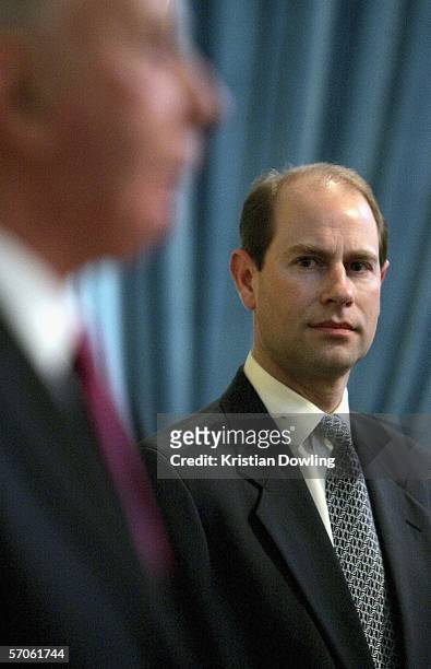 Prince Edward, Earl of Wessex looks on as Governor of Victoria and former Olympic athlete John Landy addresses the media during the Melbourne 2006...