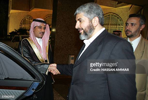 Hamas leader Khaled Meshaal is greeted by a Saudi man at a conference palace in Riyadh, 12 March 2006. A visiting Hamas delegation said yesterday...
