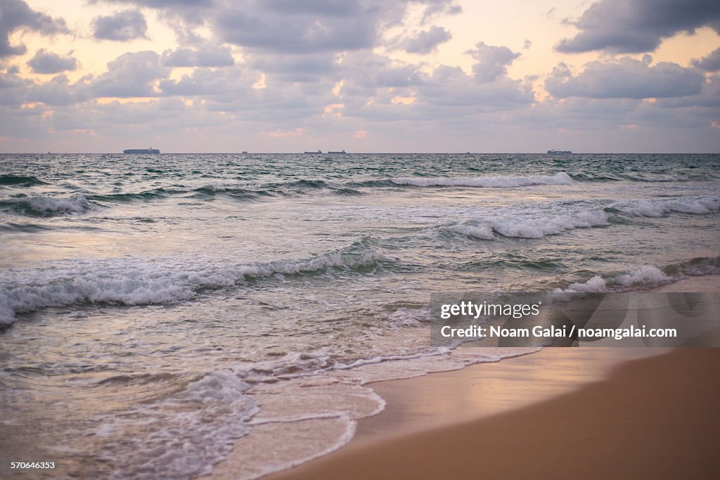 Empty beach during sunset