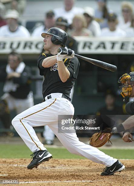 Jason Bay of the Pittsburgh Pirates hits a home run against the Tampa Bay Devil Rays on March 12, 2006 at McKechnie Field in Bradenton, Florida.