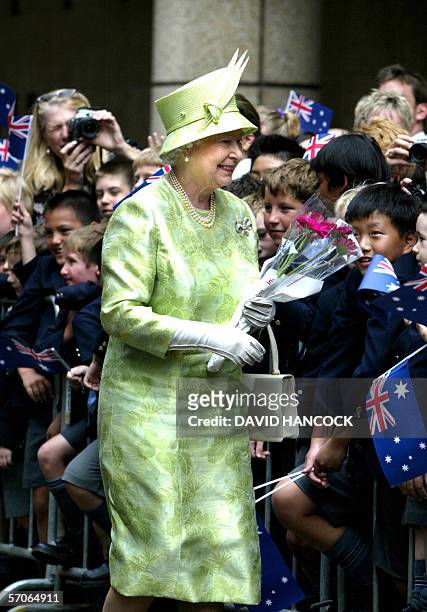 Queen Elizabeth II is greeted by Australian school children after a Commonwealth Day service at St Andrews Cathedral in Sydney 13 March 2006. The...