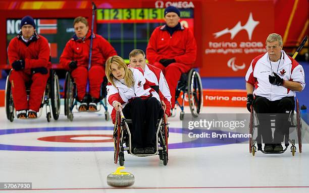 Sonja Gaudet of Canada releases the stone during Wheelchair Curling match between Norway and Canada on day three of the Turin 2006 Winter Paralympic...