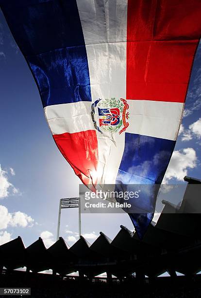 Fan flies the Dominican Republic flag during the game against Cuba during Round 2 of the World Baseball Classic on March 13, 2006 at Hiram Bithorn...