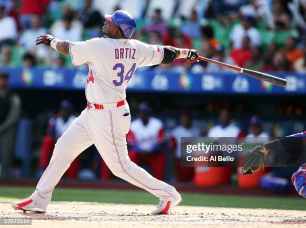 David Ortiz of the Dominican Republic swings against Cuba during Round 2 of the World Baseball Classic on March 13, 2006 at Hiram Bithorn Stadium in...