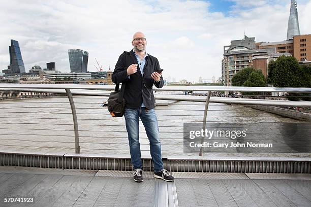 commuter laughing using cell phone, in city. - city of london workers stock pictures, royalty-free photos & images