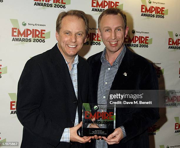 Directors Nick Park and Steve Box pose in the awards room with the award for Best Director for Wallace & Gromit in The Curse of the Were-Rabbit at...